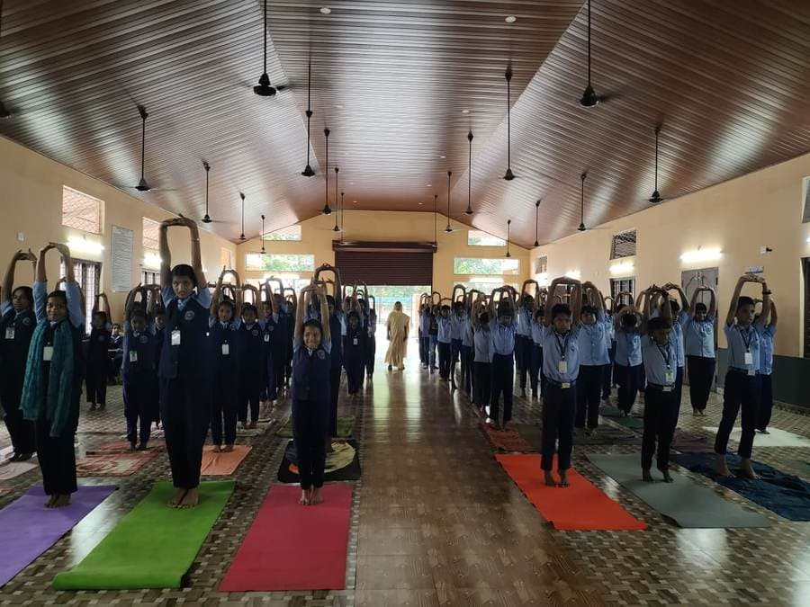 International Yoga Day — students in tree pose