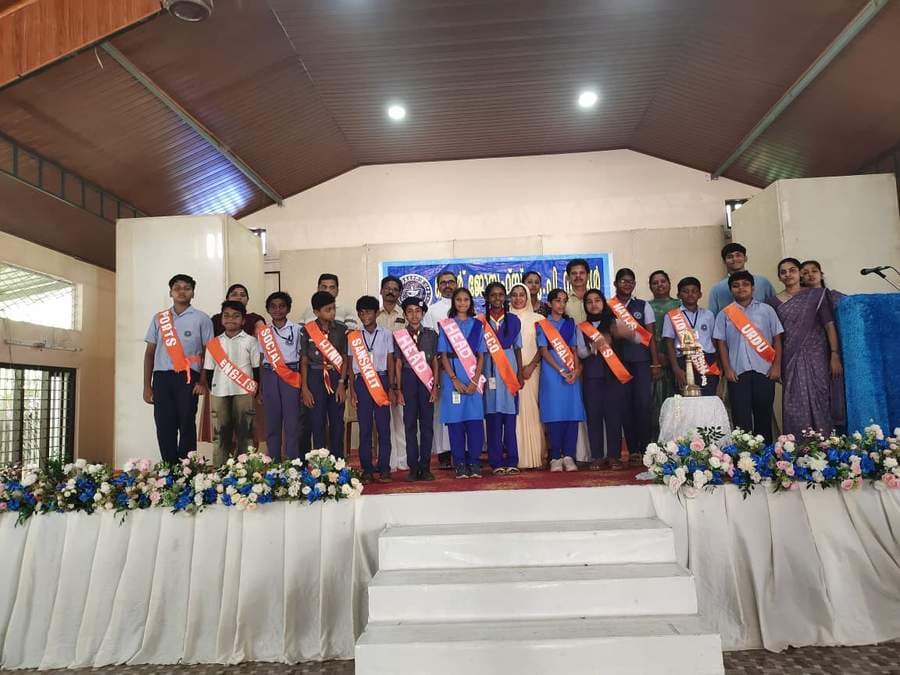Newly elected student leaders on stage with their portfolio sashes
